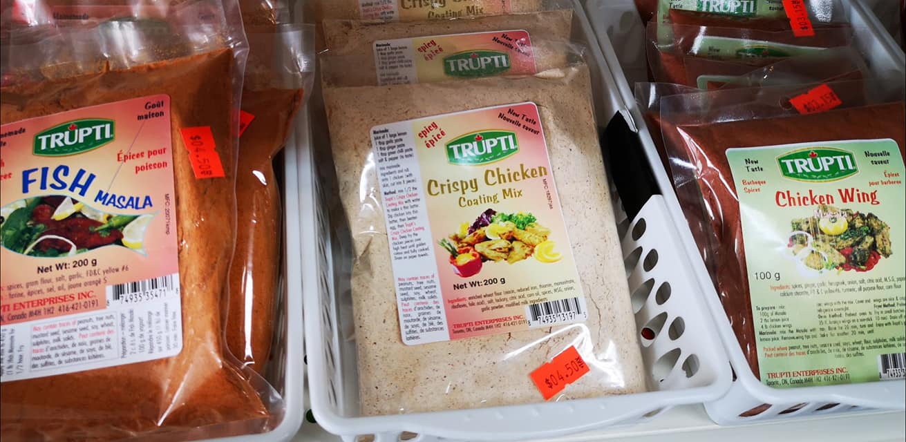 Indian spices and cooking ingredients neatly arranged on shelves