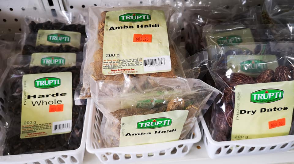 Wide view of stocked aisles with products from multiple countries